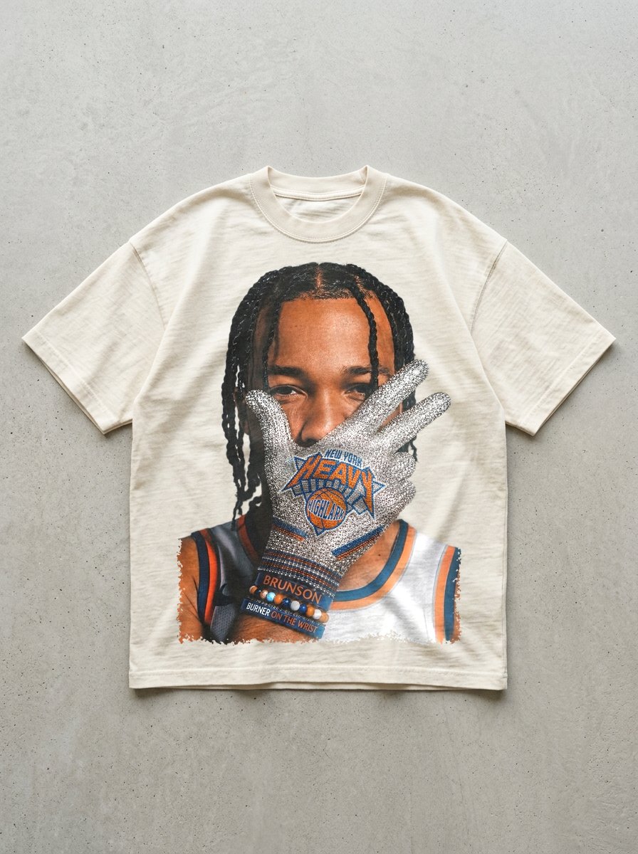 HEAVY x Highlark Knicks Finals tee front graphic, glove-to-face print on cream.