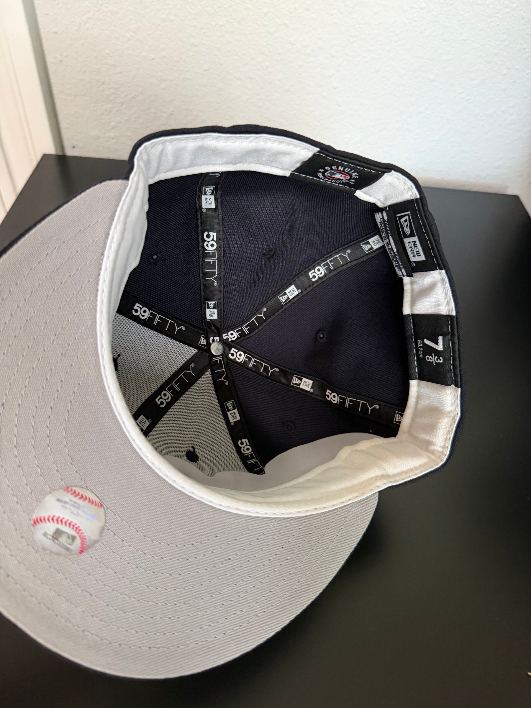 Interior with white sweatband and gray undervisor, size 7 3/8