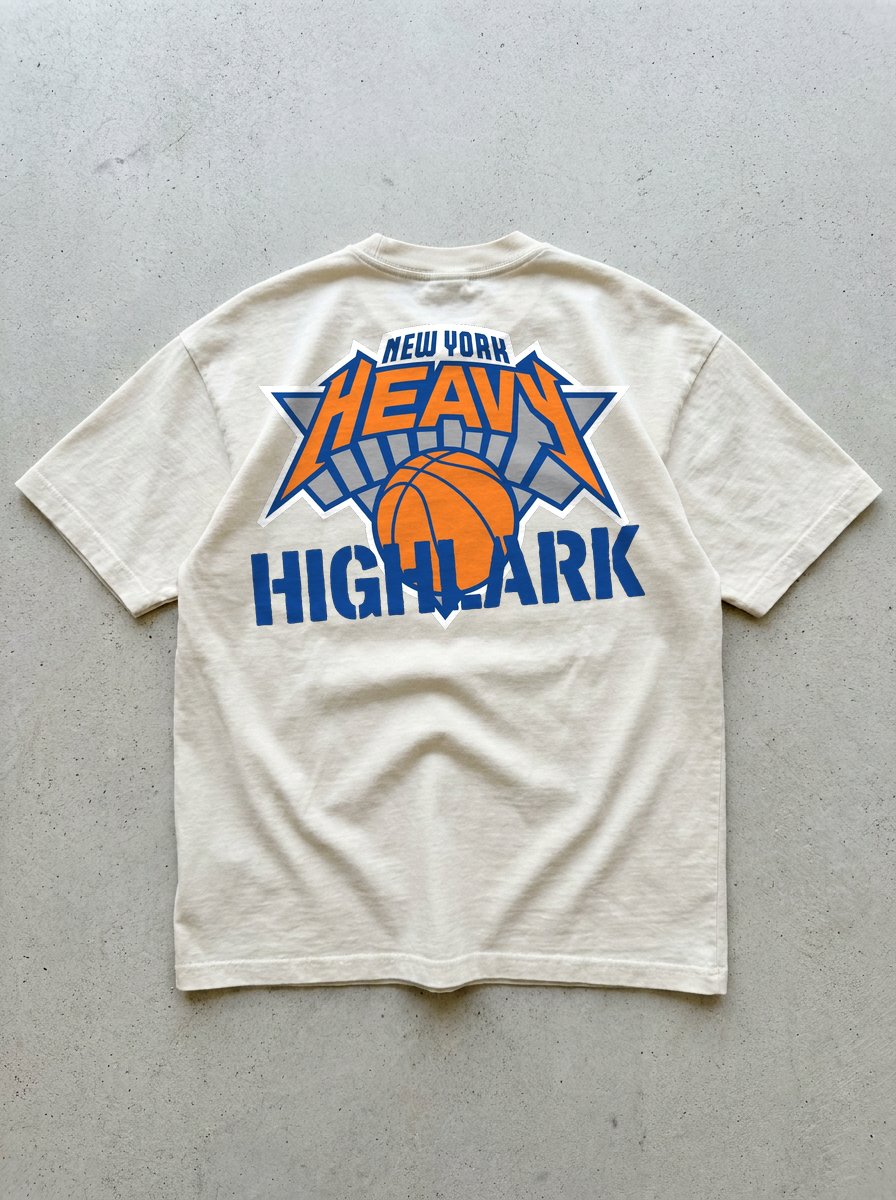 HEAVY x Highlark Knicks Finals tee back graphic, NY HEAVY x Highlark crest on cream.