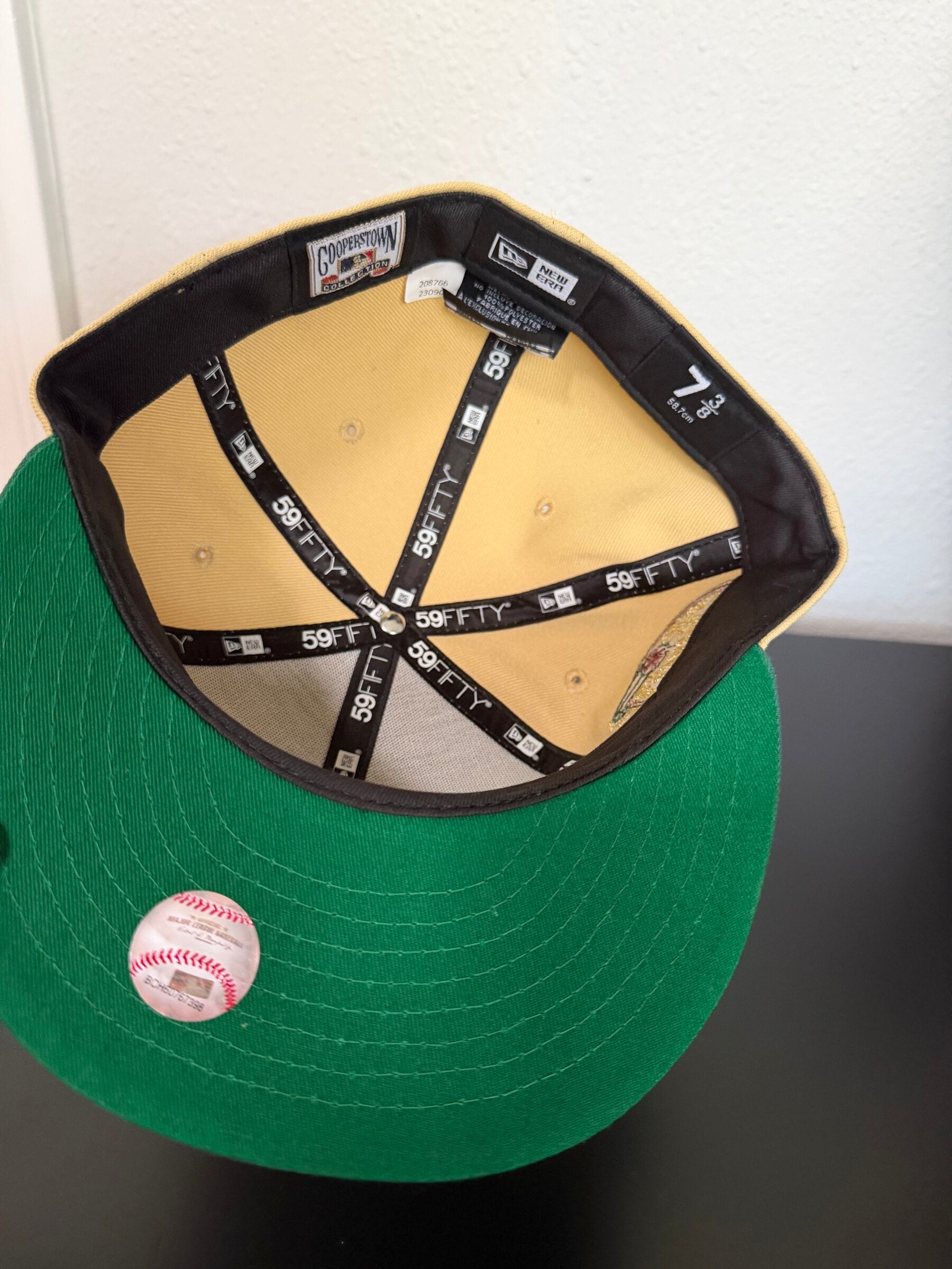 Interior with Cooperstown Collection label and green undervisor, size 7 3/8