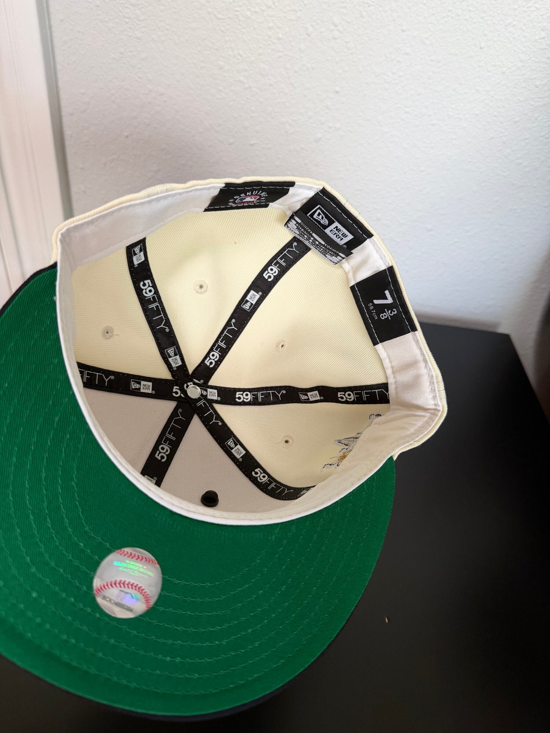 Interior with white sweatband and green undervisor, size 7 3/8