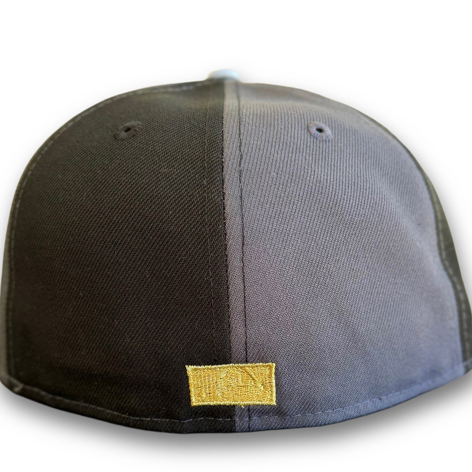 Metallic gold MLB Batterman embroidery on back panel of Highlark Orioles 007 James Bond fitted hat