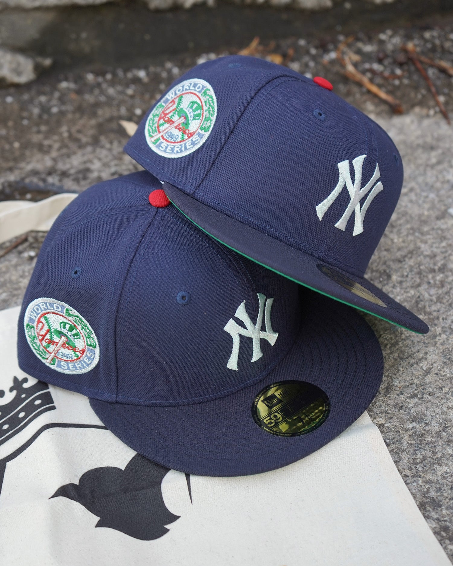 Highlark Timeless Yankees fitted hat front and side view showing metallic iris NY logo and 1949 World Series patch