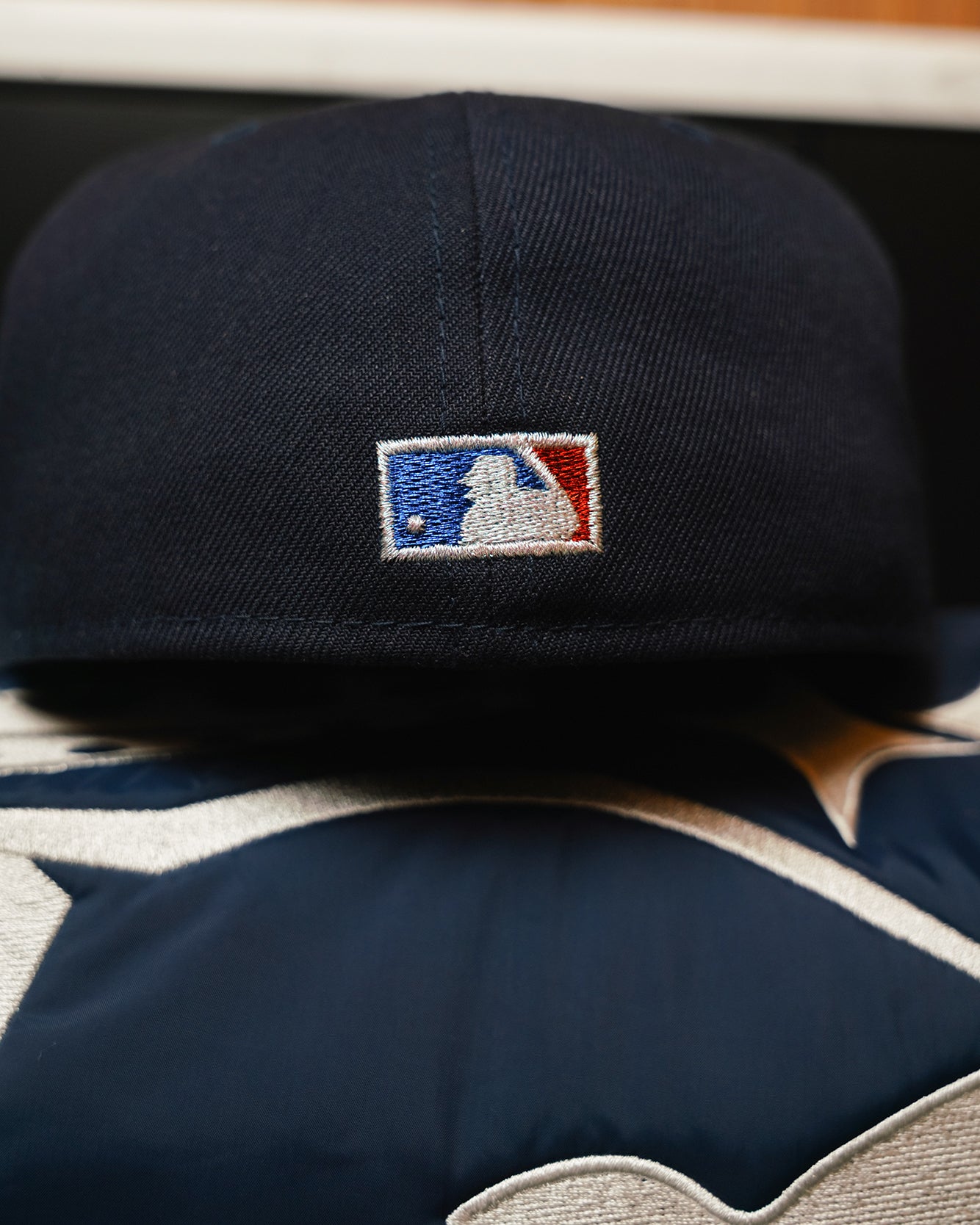 Embroidered MLB batterman logo on back of Highlark Timeless Yankees navy fitted hat